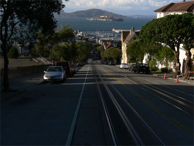 A very steep street with cable line in centre 