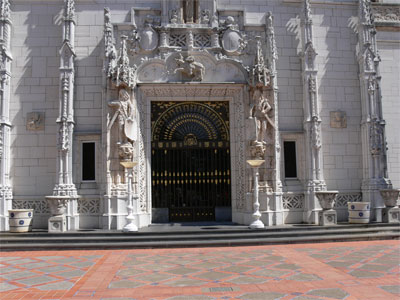 detail surrounding front door - 2 warriors on guard