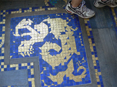 inlaid gold flakes in floor tiles