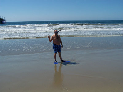 Surf's up! John tries to go snorkeling in the Pacific. Turned out the waves were too rough for an enjoyable swim. 